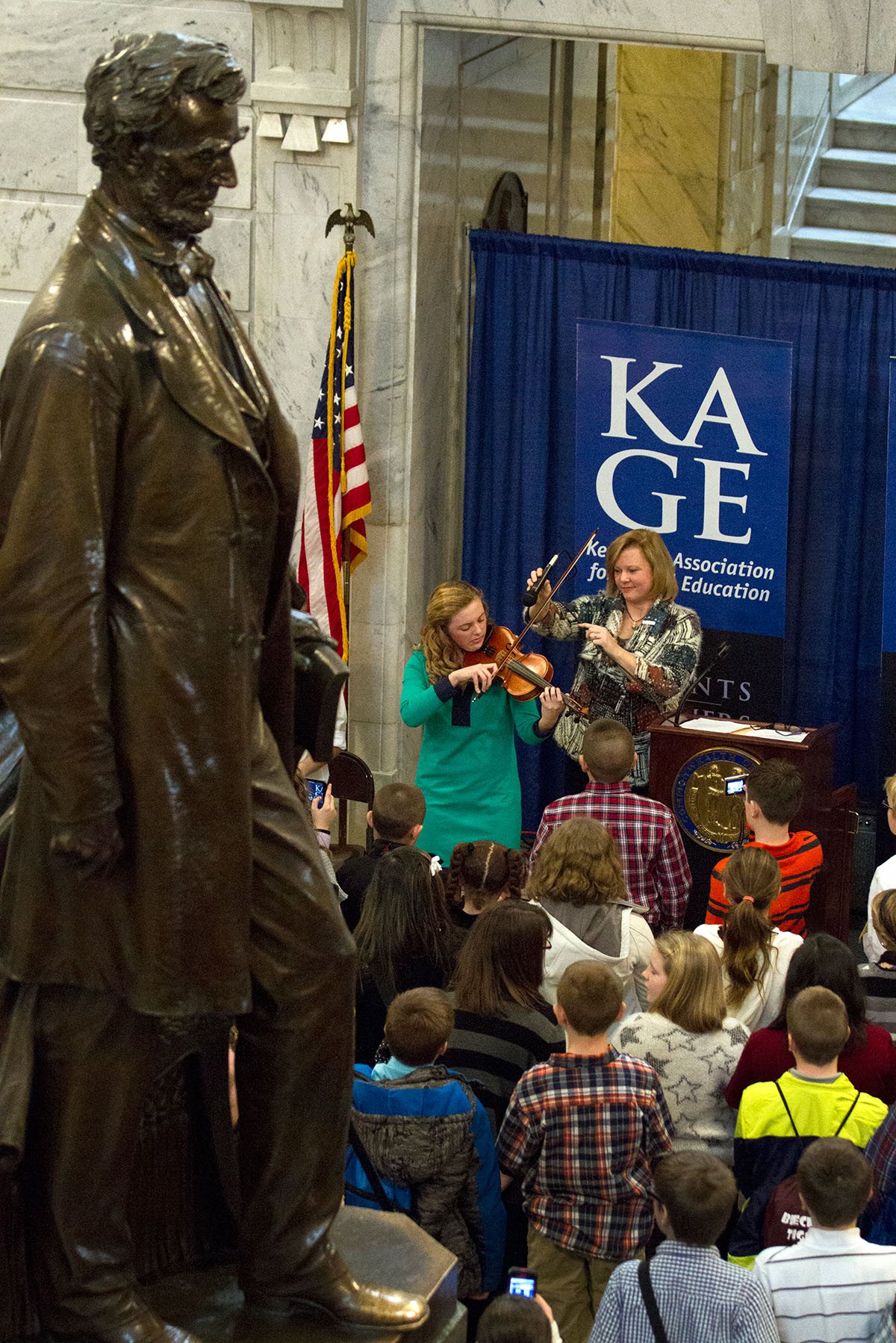 Katherine Goble, the 2010 KAGE Distinguished Student, plays "My Old Kentucky Home" during the ceremony.