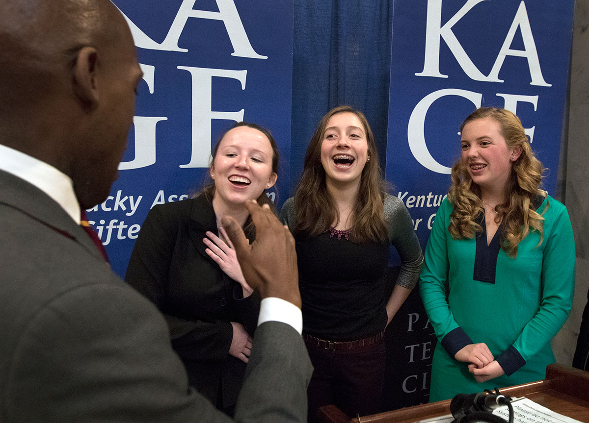 Colmon Elridge, executive assistant to Governor Beshear, talks with Gatton Academy senior Julia Gensheimer (from left), 2012 KAGE Distinguished Student Kasey Fields and 2010 KAGE Distinguished Student Katherine Goble after the ceremony.