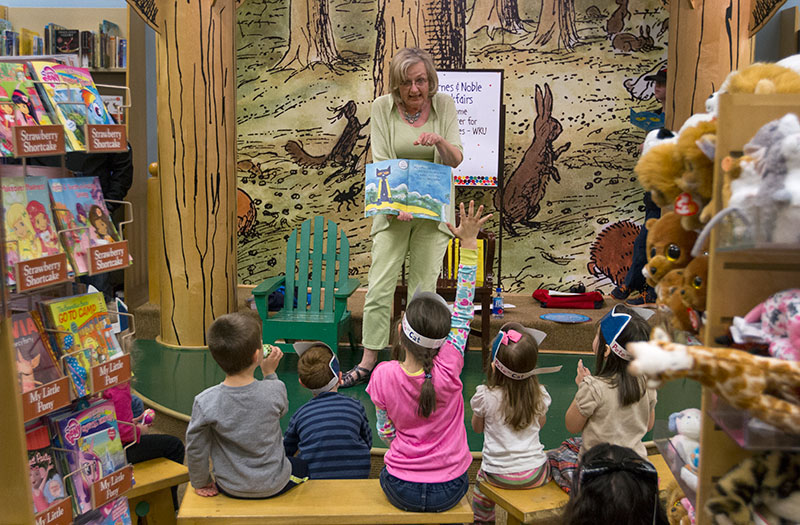 Kathy Read read "Pete the Cat and His Four Groovy Buttons" in the story time center.