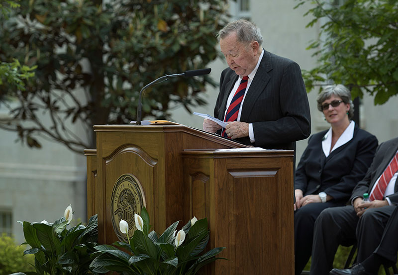 Carol Martin “Bill” Gatton reads a poem while addressing the crowd.