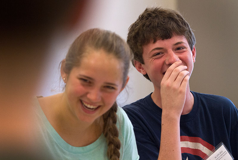 Mary Baker of Paducah and Jared Rodgers of Verona laugh after Jared flubbed while rehearsing for "12 Angry Pigs," a parody of "12 Angry Men" June 11 in Acting. Mary and Jared are both taking acting for the second time. (Photo by Sam Oldenburg)