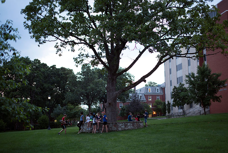 Campers in Jake Inman's group join other campers outside Northeast Hall for community time.  (Photo by Emilie Milcarek)
