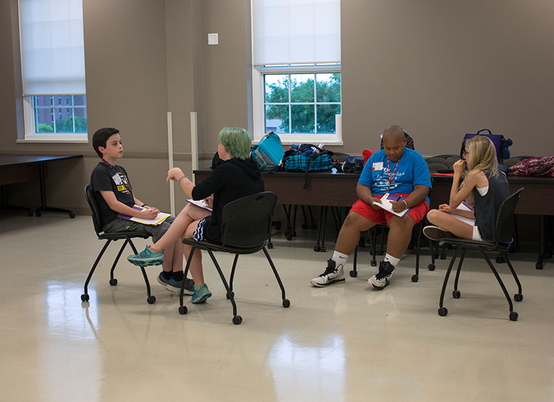 On the first day of Acting June 8, students interview each other to learn fun facts about their classmates. The students then used the information they gathered to make a short skit about their partner. (Photo by Emilie Milcarek)