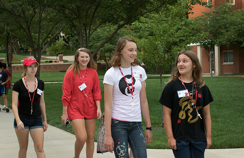 Ashley Johnson (from left) of Liberty, Lora Darnell of Lafayette, Tennessee, and Kate Sweeney and Holley Yelton of Crestwood explore the grounds of WKU on their group campus tour the first day of VAMPY Sunday, June 21. (Photo by Emilie)