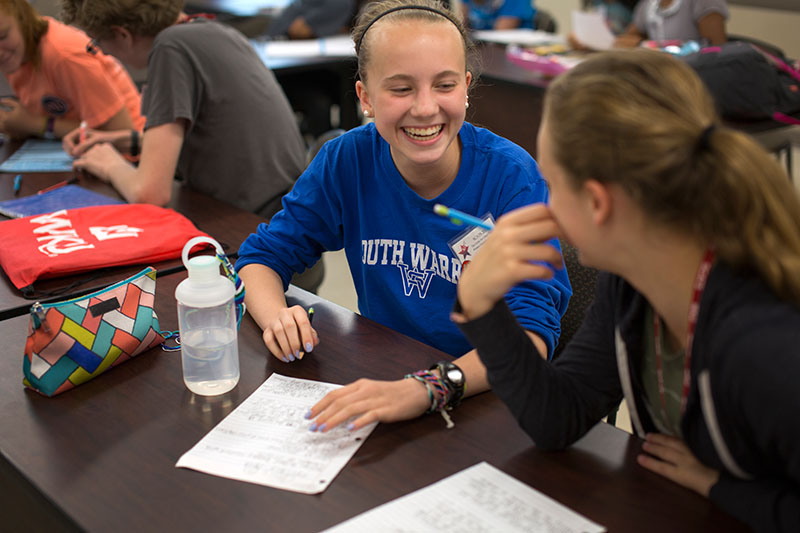Amelia Nauman of Bowling Green laughs while working on a project with a classmate in Leadership and Teamwork on Thursday, June 18. (Photo by Emilie Milcarek)