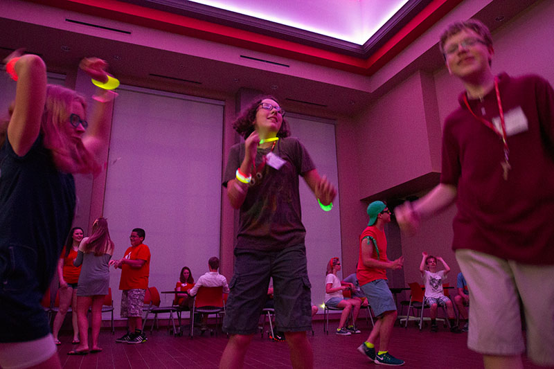 Abby Adams-Smith (from left) of Bowling Green, Emma Simpson of Bowling Green, and Griffin Salsman of Springfield, Tenn., dance during the SCATS Dance Thursday, June 18. (Photo by Sam Oldenburg)