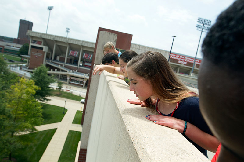 Laina Caywood of Georgetown watches the results of an egg drop alongside her classmates in Problems You Have Never Solved Before atop Parking Structure 2 Tuesday, June 23. (Photo by Sam Oldenburg)