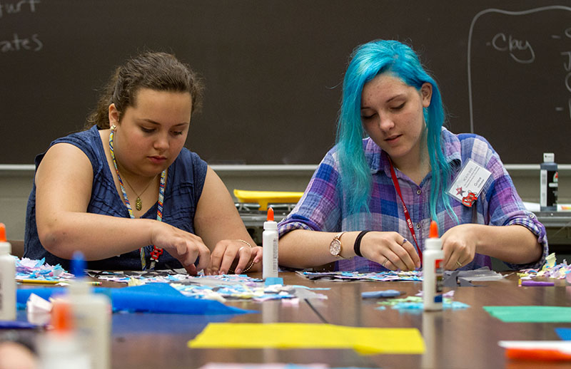 Rachel Toll (left) of Shepherdsville and Grace Whitaker of Burkesville work on a stained glass window project in Mixed Media Multicultural Art Experience Tuesday, June 9. (Photo by Sam Oldenburg)