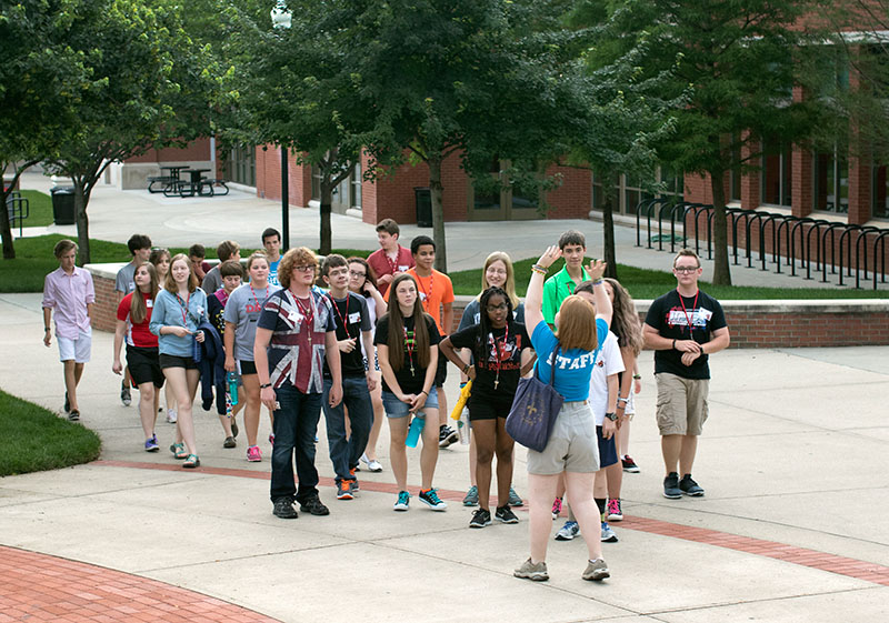 Counselor Nicole Heimerdinger leads her group on a tour of WKU's campus Sunday, June 21. Counselors pointed out where different classes meet and taught campers the designated walking path. (Photo by Emilie Milcarek)
