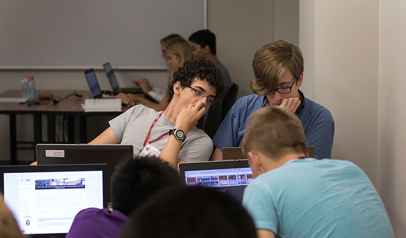 Evan Poole of Central City and Christian Lauritzen of Lexington work on their coding project in Computer Science Friday, June 26. (Photo by Emilie Milcarek)