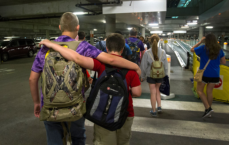 Tyler Thomas (left) of Bowling Green and Scott Tobe of Louisville walk through a parking garage at the Nashville International Airport after returning from a day-long field trip to Washington D.C. Tuesday, June 30. (Photo by Sam Oldenburg)