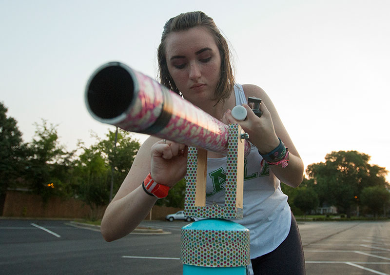 Emily Leamon of Frankfort assembles the telescope she made in Astronomy before a stargazing party Monday, July 6. (Photo by Sam Oldenburg)
