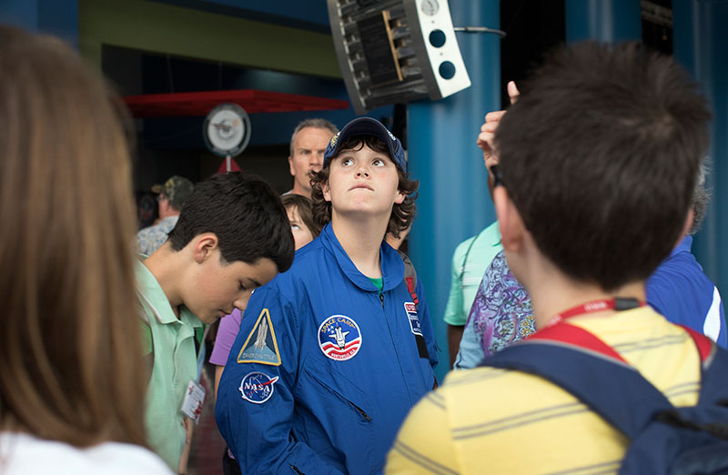 Zach Hanvey of Paris looks up at rockets and capsules on display at the U.S. Space and Rocket Center in Huntsville, Alabama, Friday, July 3. Students in Astronomy, Problems You Have Never Solved Before, and Advanced Investigations in Chemistry took a day-long trip to the center. (Photo by Emilie Milcarek)