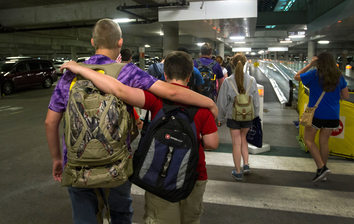 Tyler Thomas (left) of Bowling Green and Scott Tobe of Louisville walk through a parking garage at the Nashville International Airport after returning from a day-long field trip to Washington D.C. Tuesday, June 30. Two VAMPY classes went on the trip. (Photo by Sam Oldenburg)