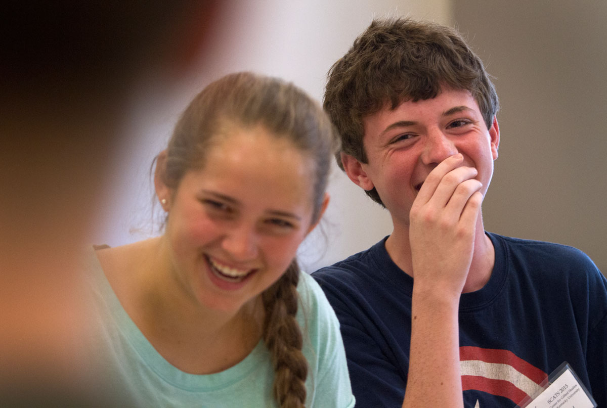 Mary Baker of Paducah and Jared Rodgers of Verona laugh after Jared flubbed a line while rehearsing for "12 Angry Pigs," a parody of "12 Angry Men" June 11 in SCATS Acting class Wednesday, June 10. (Photo by Sam Oldenburg)