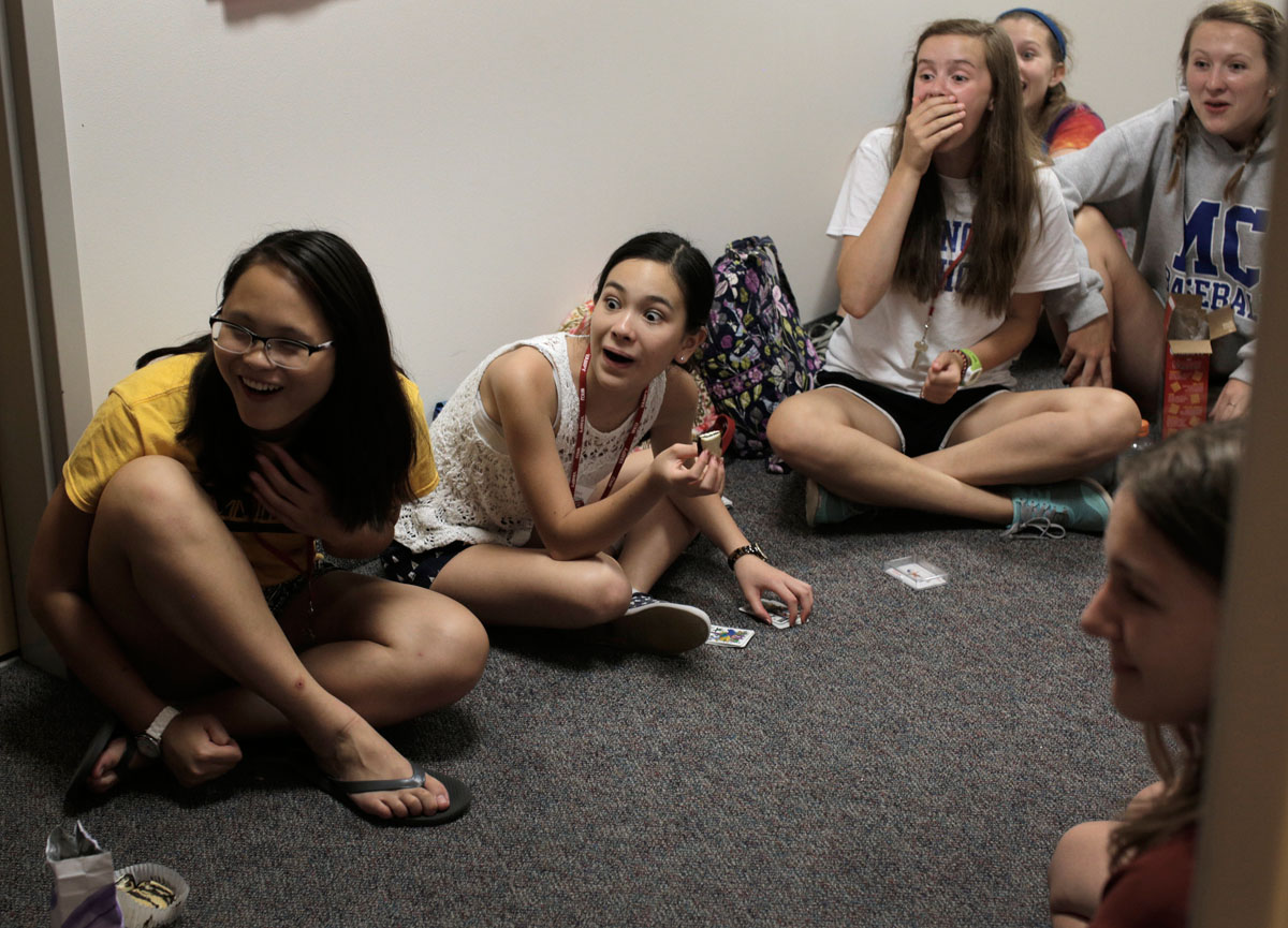 During hall time Wednesday, June 24, VAMPY campers react to a story being told by their counselor, Courtney George. (Photo by Emilie Milcarek)