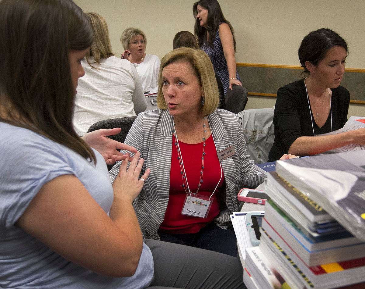 Tracy Inman answers questions from a teacher during the Kentucky Student Growth Project professional development June 8 at the Knicely Conference Center in Bowling Green.