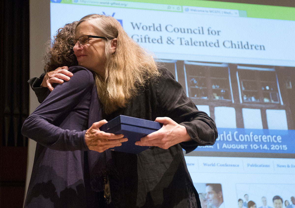 President of the World Council for Gifted and Talented Children Leslie Graves presents the International Award for Research to June Maker, a WKU alumnus.