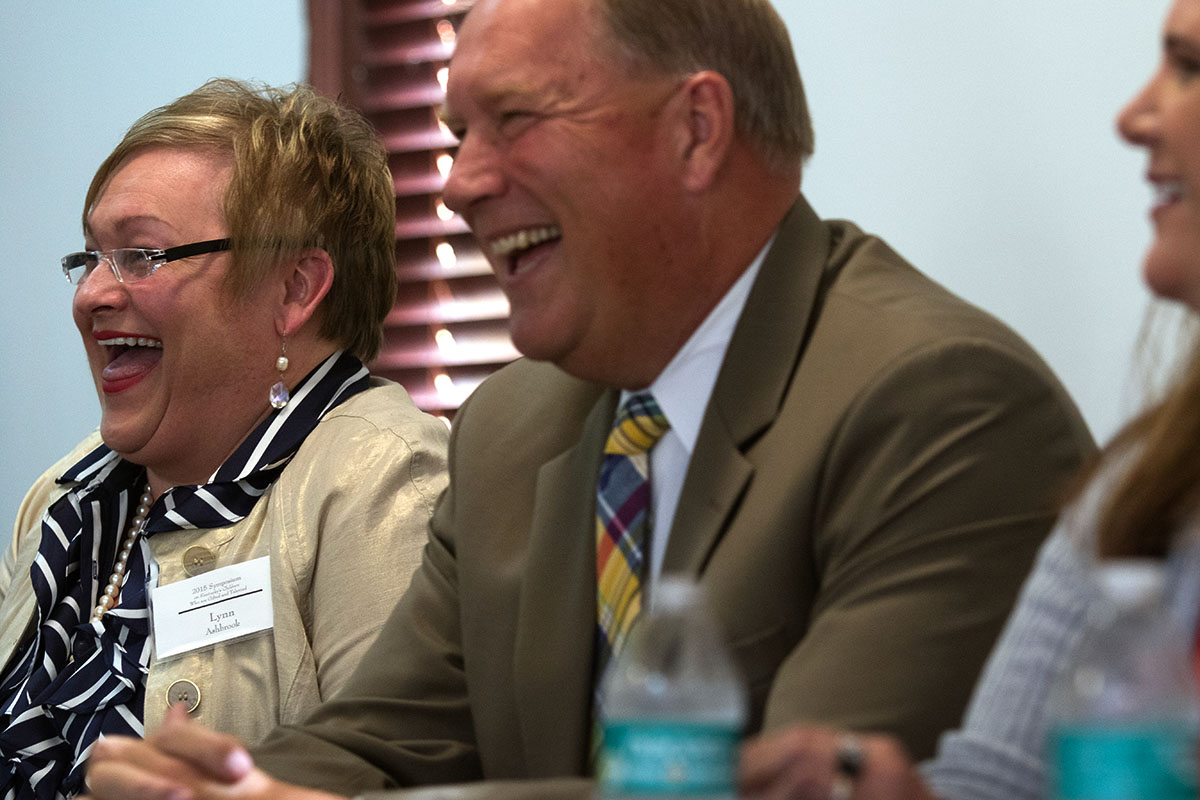 Lynn Ashbrook, director of gifted education programs for Pulaski County Schools and Pulaski County Superintendent Steve Butcher laugh while participating in a panel discussion during the Symposium October 13.