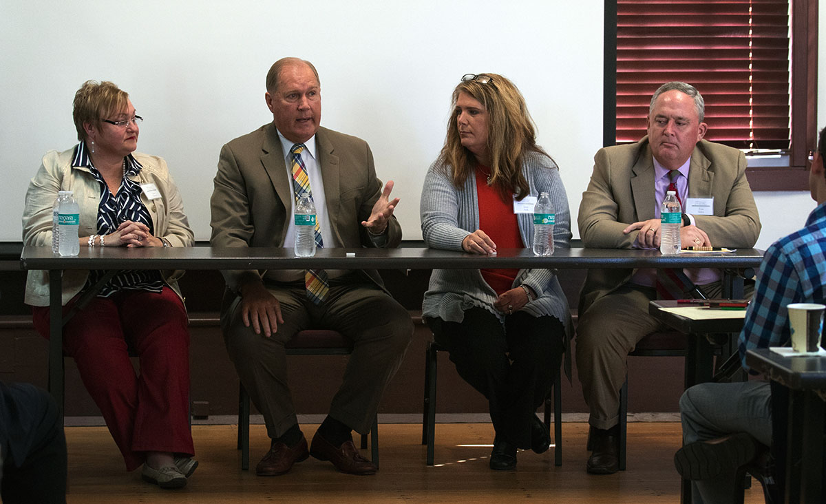 Panelists Lynn Ashbrook, director of gifted education programs for Pulaski County Schools (from left);Pulaski County Superintendent Steve Butcher; Breckinridge County Superintendent Janet Meeks; and Tom Shelton, executive director of the Kentucky Association of School Superintendents participate in a discussion October 13 during the Symposium.