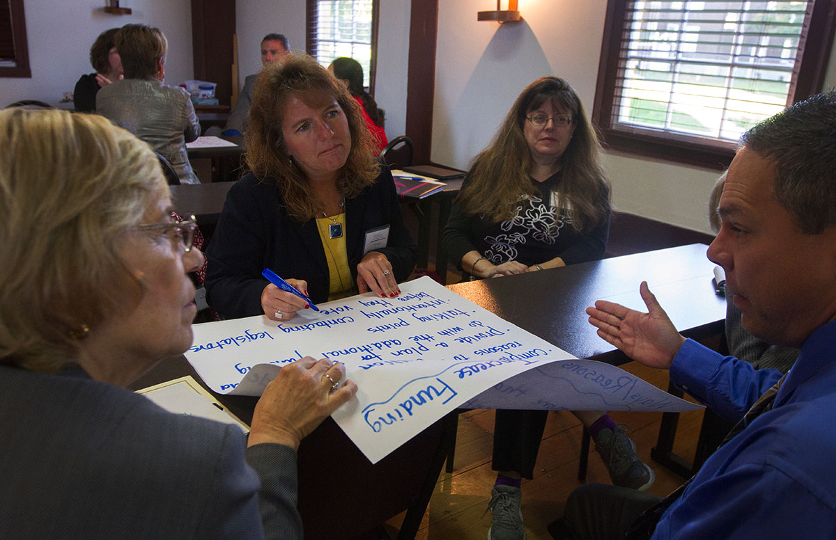 Symposium attendees discuss possible ways to increase funding for gifted education October 14.