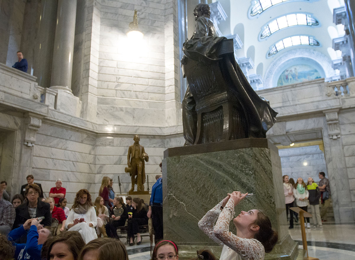 Sixth grader Mickenna Harthun takes a picture of the rotunda before a ceremony celebrating Gifted Education Month in Kentucky February 3 at the State Capitol in Frankfort.