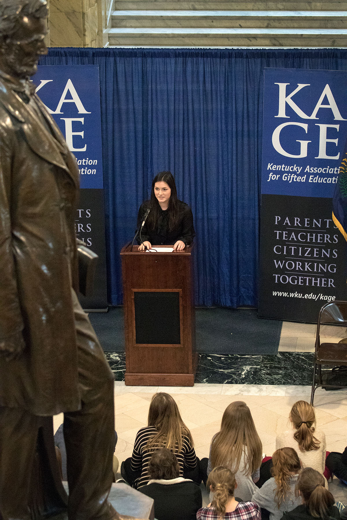 Gatton Academy senior Anne Barrett Wetzel speaks  during a ceremony celebrating Gifted Education Month in Kentucky February 3 at the State Capitol in Frankfort.