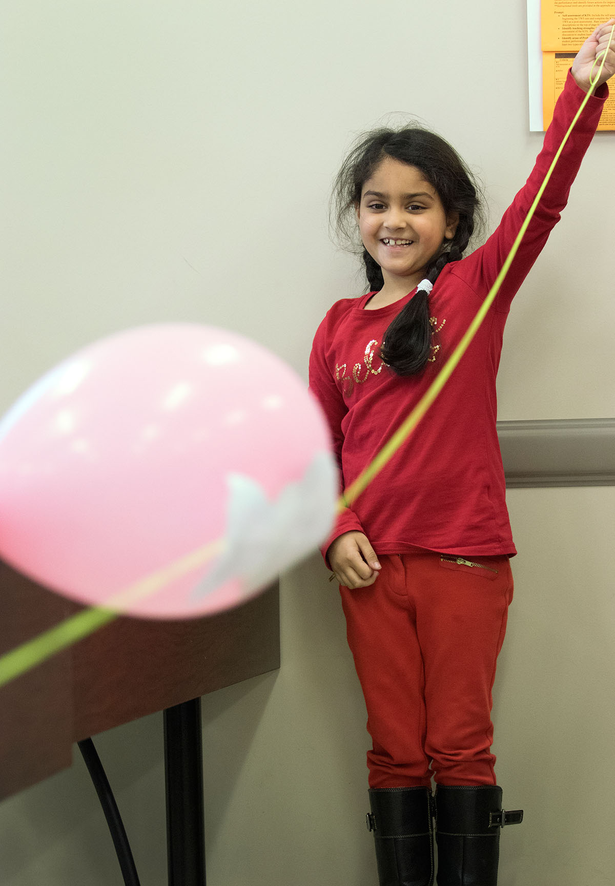 Aanya Gupta races a balloon down a string in Fun with Physics.