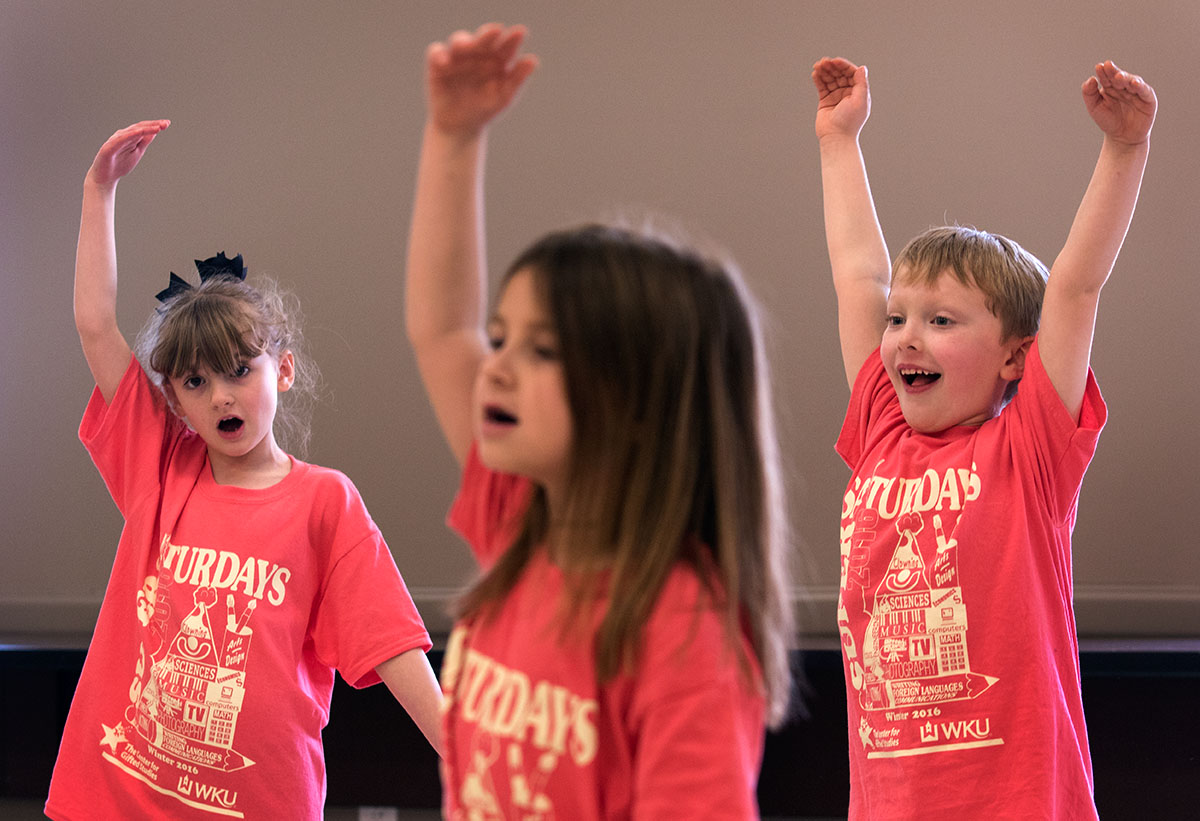 Izzy Roan (from left), Logan Lewis, and Charlie Gilpin rehearse for "Howdy Neighbor" during Intro to Musical Theatre: Let's Sing and Dance. The class was preparing to perform the musical for parents at the end of the final Saturday.