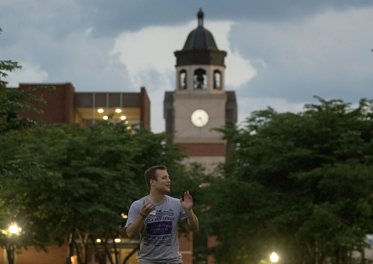 Counselor Peyton Cuzzart leads a game of Pest Control — a spin-off of freeze tag he created that involves roles of mosquitoes, exterminators, and doctors — during mandatory optionals Thursday, June 16, on Centennial Mall. (Photo by Sam Oldenburg)
