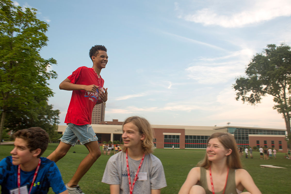 Malcolm Jones of Louisville runs from the camper who tagged him during a game of Fish, Fish, Dinosaur on Sunday, June 26. The game was similar to Duck, Duck, Goose. (Photo by Tucker Allen Covey)