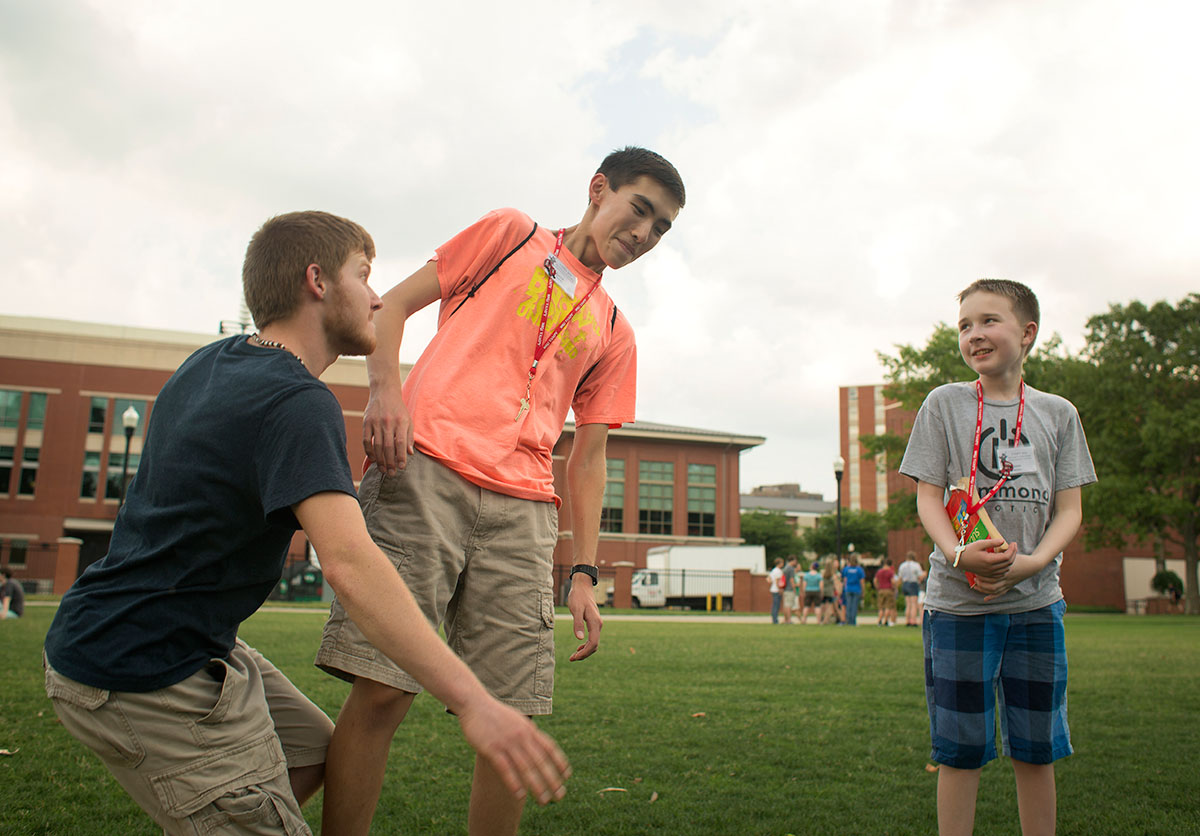 Campers Drew Epperson (from left) of Prestonburg and David Suarez from Somerset engage in a game of Pterodactyl while camper Isaac Bentley watches Sunday, June 26. (Photo by Tucker Allen Covey)