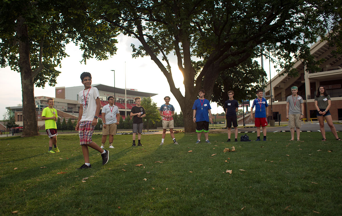 Aken China from Bowling Green moves across the circle formed by his group after being chosen to move during an icebreaker game on Sunday, June 26. (Photo by Tucker Allen Covey)