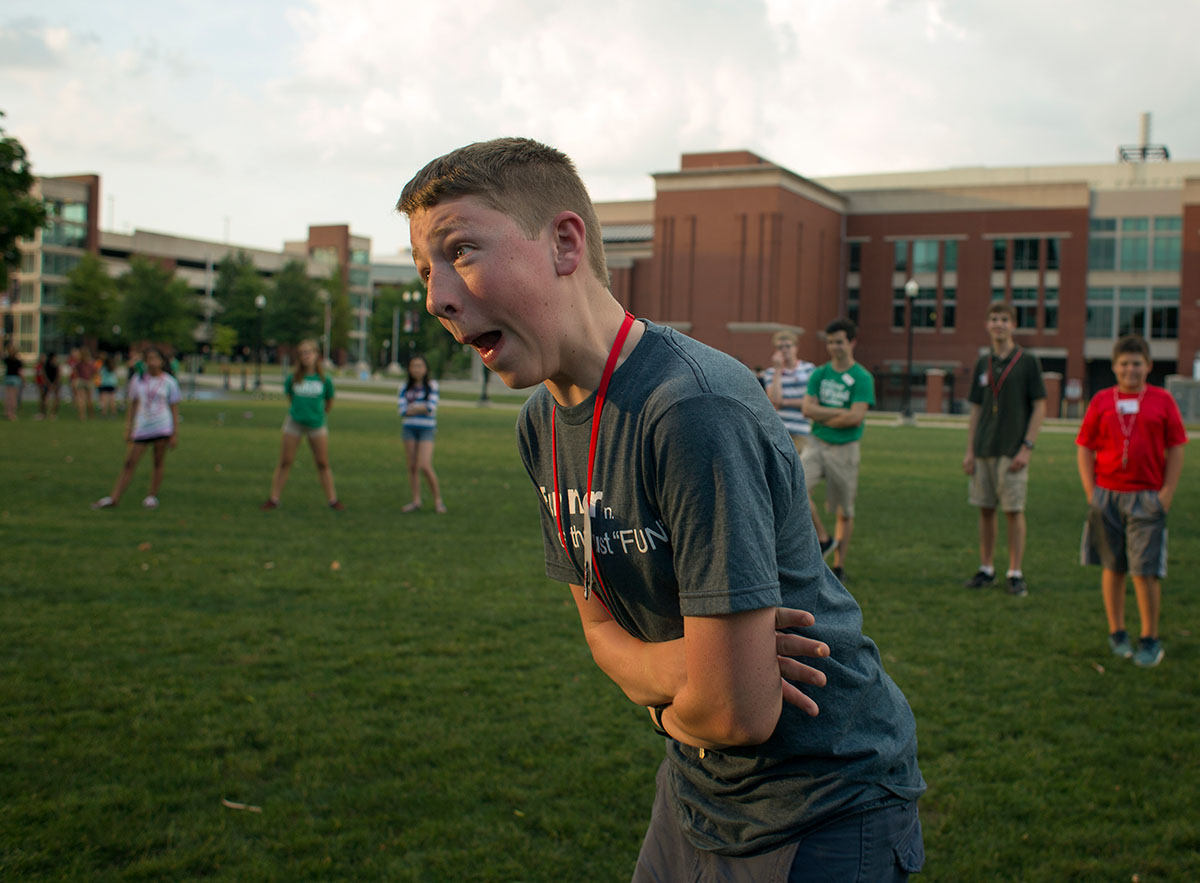 Hayden Lovell from Grain Valley, Missouri, attempts to make his challenger show teeth or laugh during a game of Pterodactyl on Sunday, June 26. (Photo by Tucker Allen Covey)