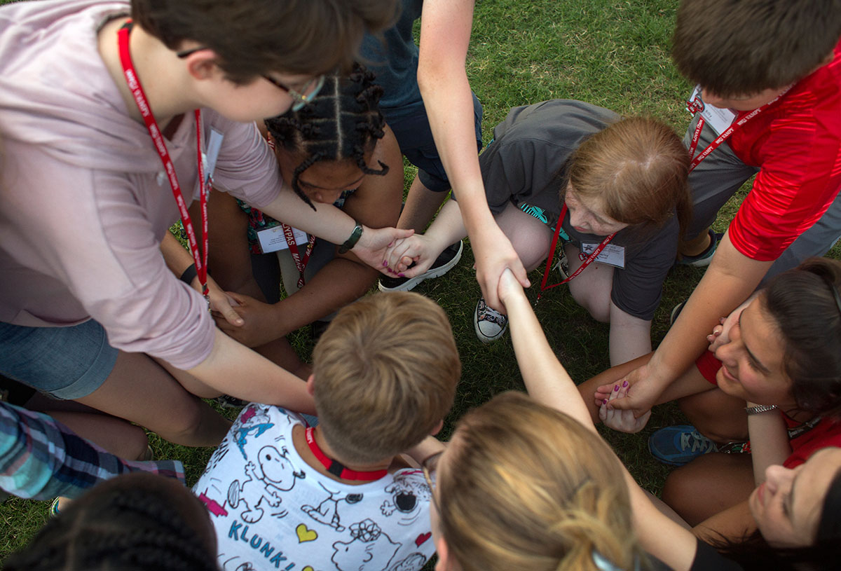 Campers attempt to untie their human knot during icebreaker games on South Lawn Sunday, June 26. (Photo by Tucker Allen Covey)