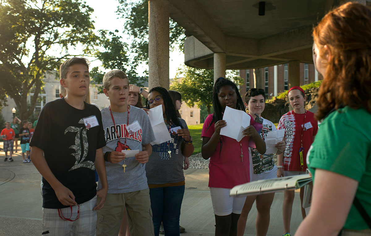 Counselor Courtney George leads campers past the Fine Arts Center while on a campus tour Sunday, June 12. (Photo by Tucker Allen Covey)