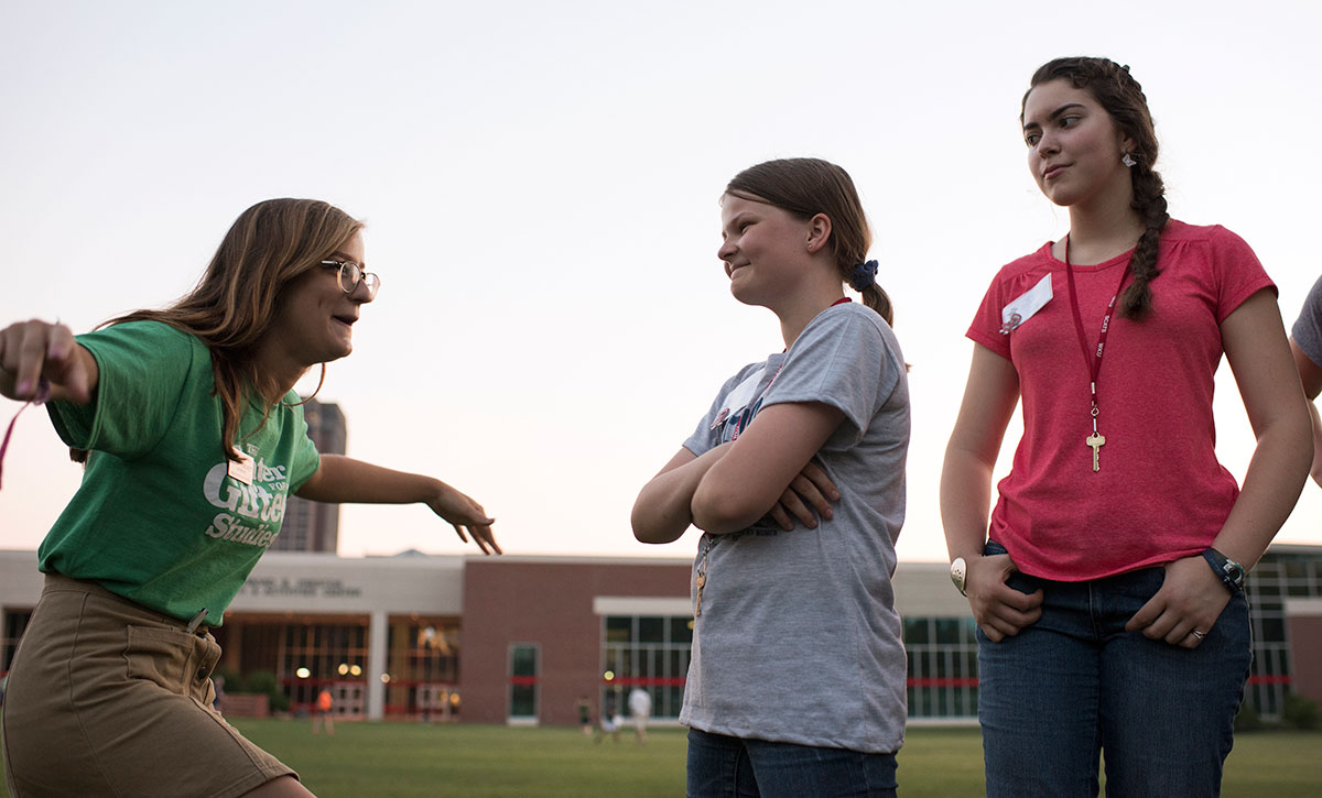 Counsellor Meredith Bickett (from left) plays Pterodactyl with campers Audrey Thacker of Louisville and Lilly Mooney of Shepherdsville Sunday, June 12. Pterodactyl consists of making odd noises and actions in order to make the opposing player laugh. (Photo by Tucker Allen Covey)