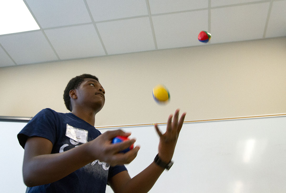 Aaron Suggs of Louisville practices juggling during Clowning Tuesday, June 21. (Photo by Sam Oldenburg)