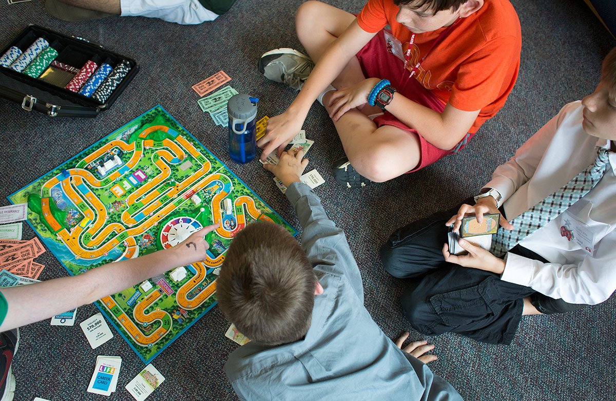 Campers play The Game of Life in Northeast Hall Sunday, June 19. (Photo by Tucker Allen Covey)