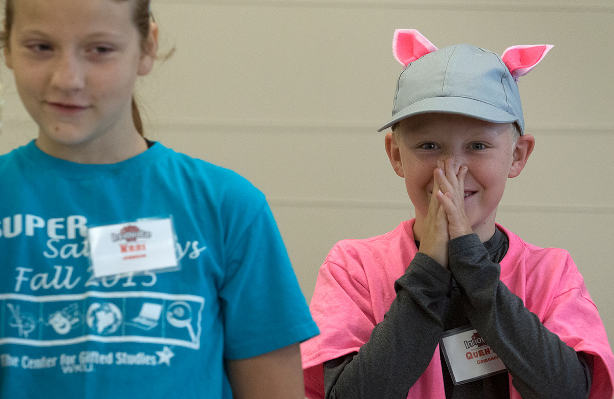 Quentin Grieshop laughs while acting out the story of the three little pigs in Math during Camp Innovate Wednesday, June 8. After acting out the story, the students used math and engineering principles to construct houses and test their stability with the wind from a haird dryer. (Photo by Sam Oldenburg)