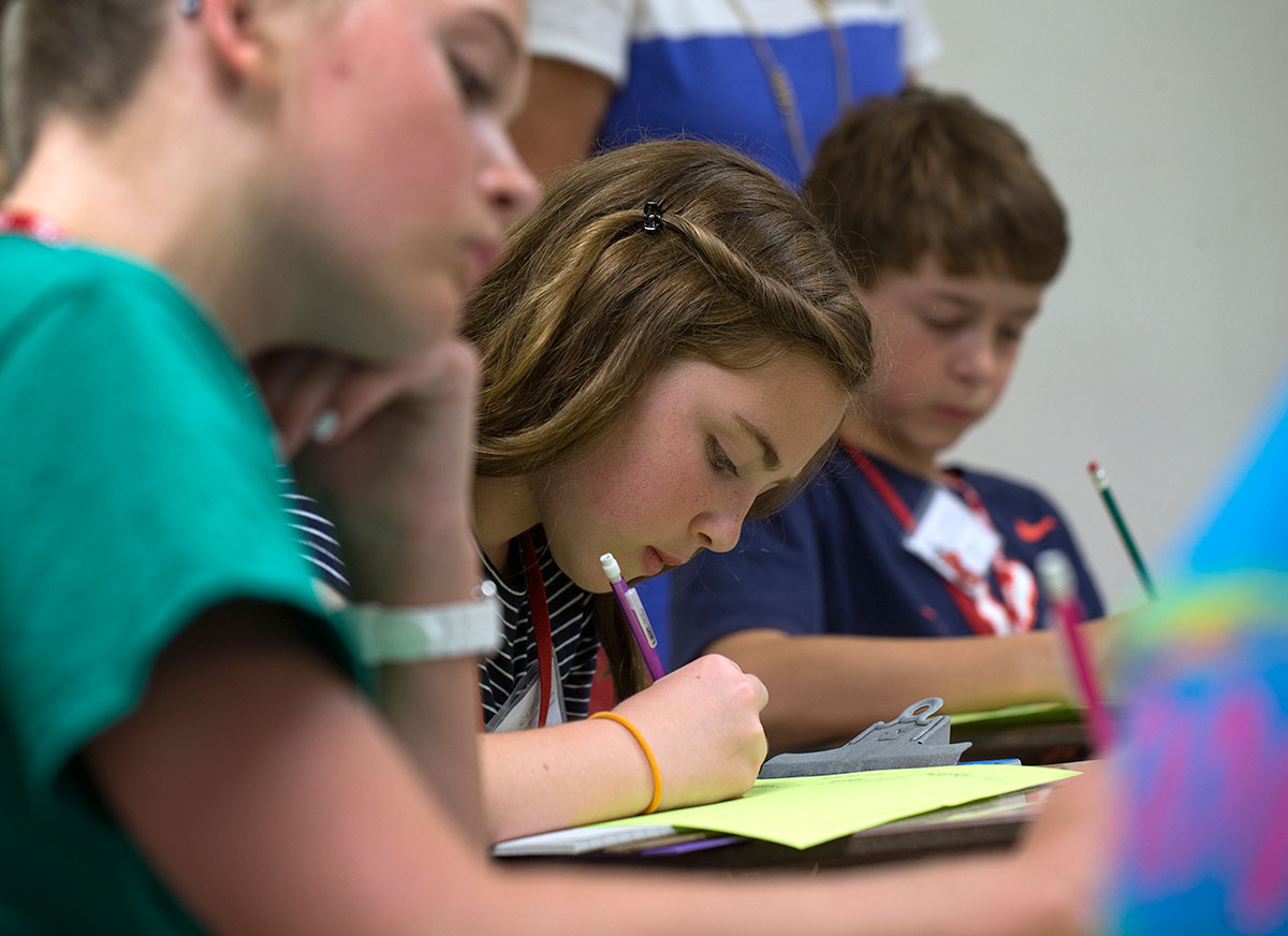 Emma McGuffy (from left) of Bowling Green, Sophie Maddux of Hopkinsville, and Colin Reed of Bowling Green work on a writing exercise during Writing Boot Camp Monday, June 13. (Photo by Tucker Allen Covey)