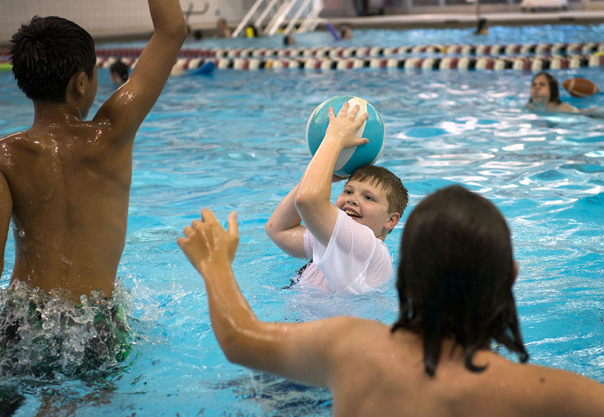 Chase Whitman of Leitchfield tries to pass the basketball around other campers while playing in the swimming pool in the Raymond B. Preston Health & Activities Center Friday, June 17. (Photo by Tucker Allen Covey)