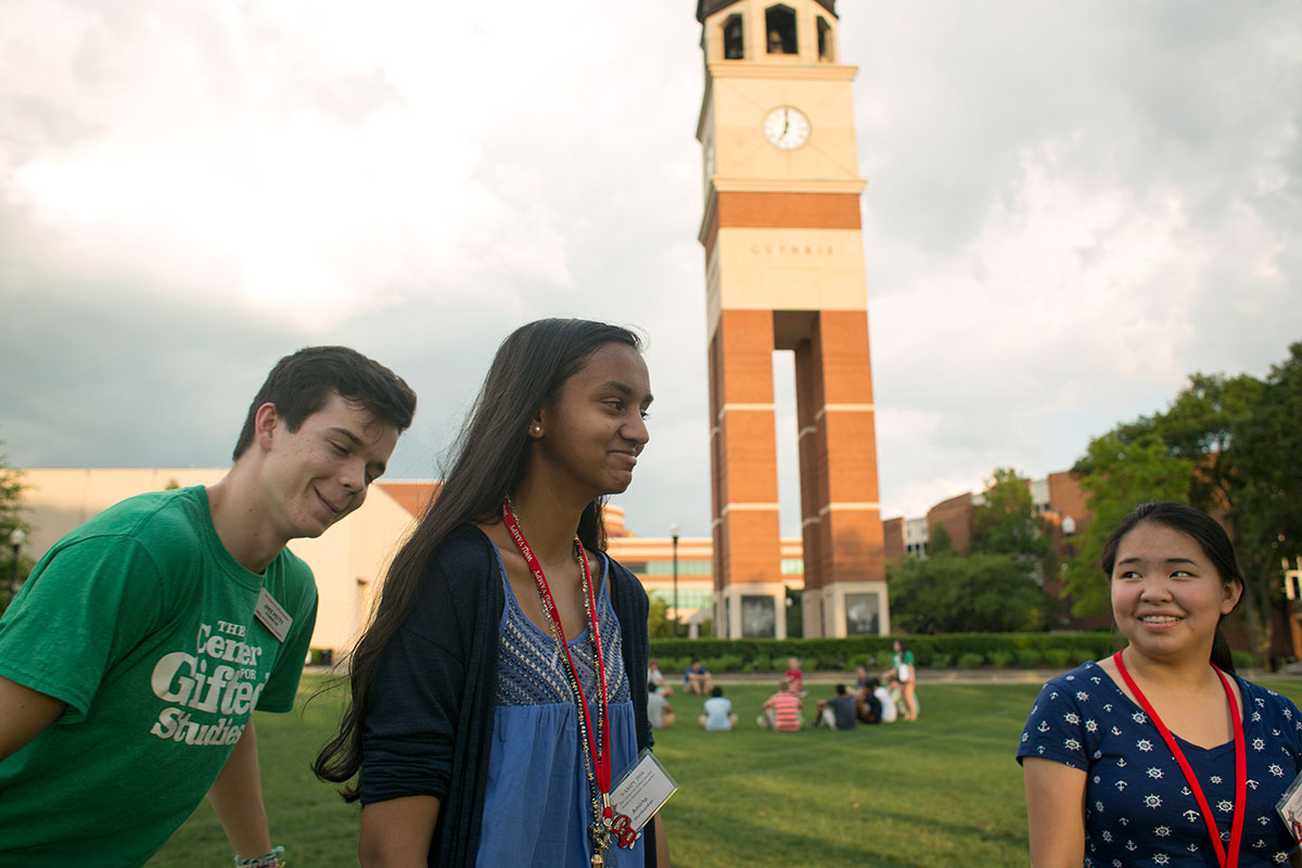 Counselor Jake Petty (from left) plays the game Pterodactyl with campers Amirta Manikandan from Cordova, Tennessee, and Anna Dong from Morganfield on South Lawn at Western Kentucky University Sunday, June 26. (Photo by Tucker Allen Covey)