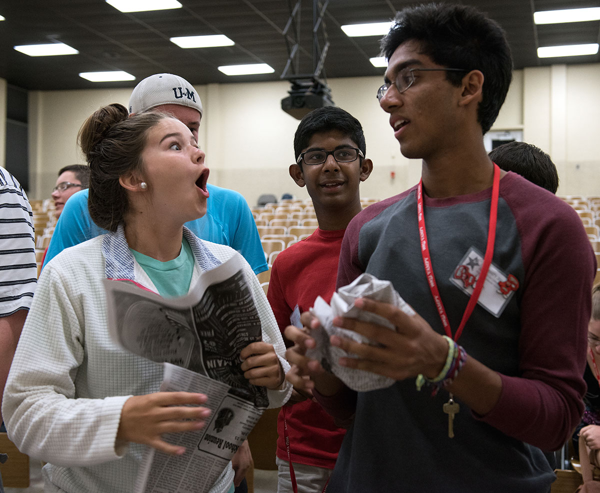 Sydney Wheeler (from left) of Scottsville, Rohan Jaisinghani  from Brentwood, Tennessee, and Yash Singh  from Bowling Green react after drawing the theme of their play for Paper Theatre Saturday, July 2. (Photo by Tucker Allen Covey)
