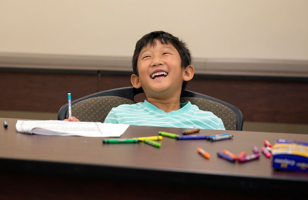 Albert Lee laughs as his teacher calls him out for knowing an answer because he read ahead in the packet in Science Monday, July 11. (Photo by Tucker Allen Covey)
