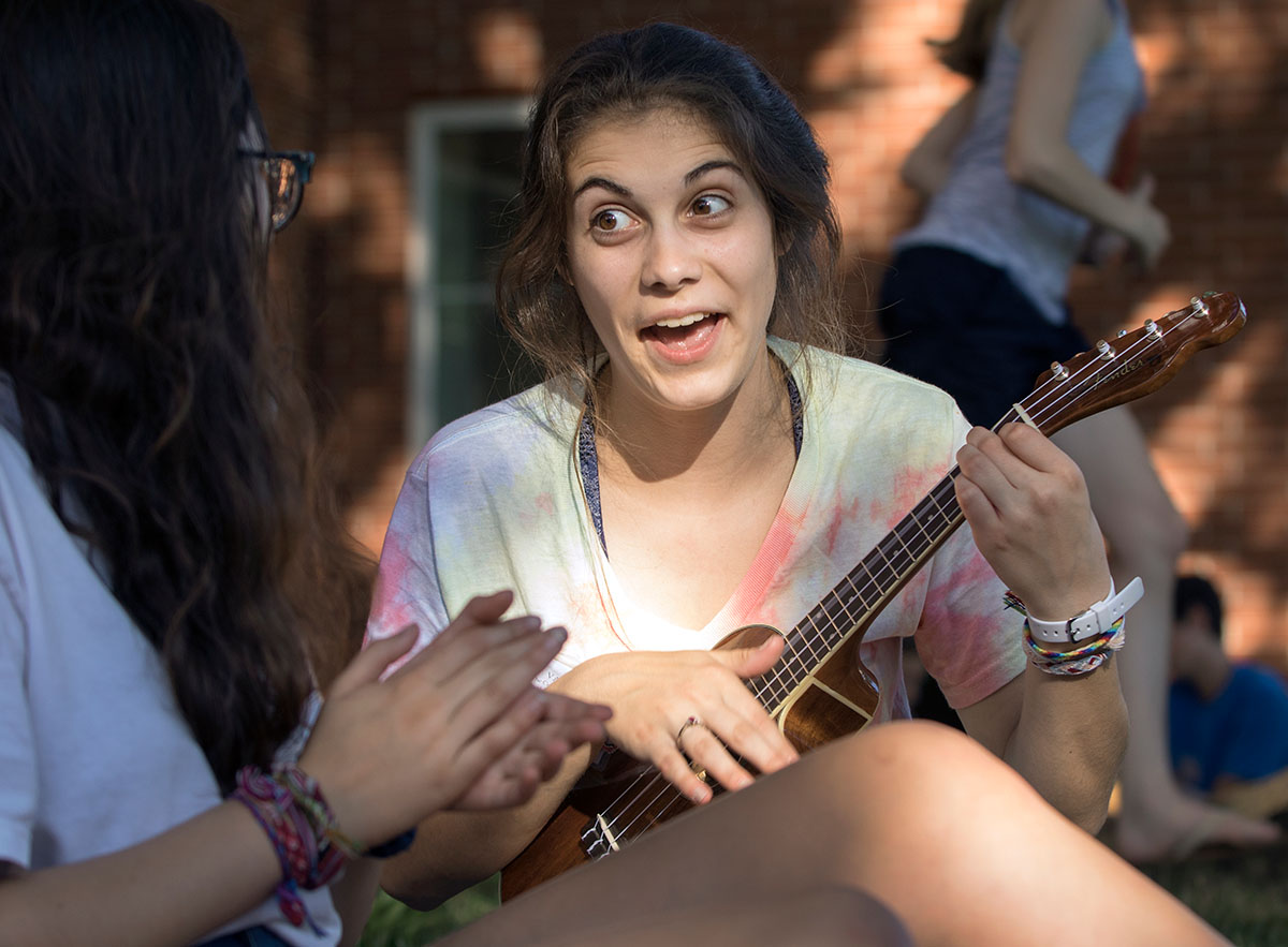 Sophia Evans of St. Louis plays ukulele during the cookout Sunday, July 10. (Photo by Sam Oldenburg)