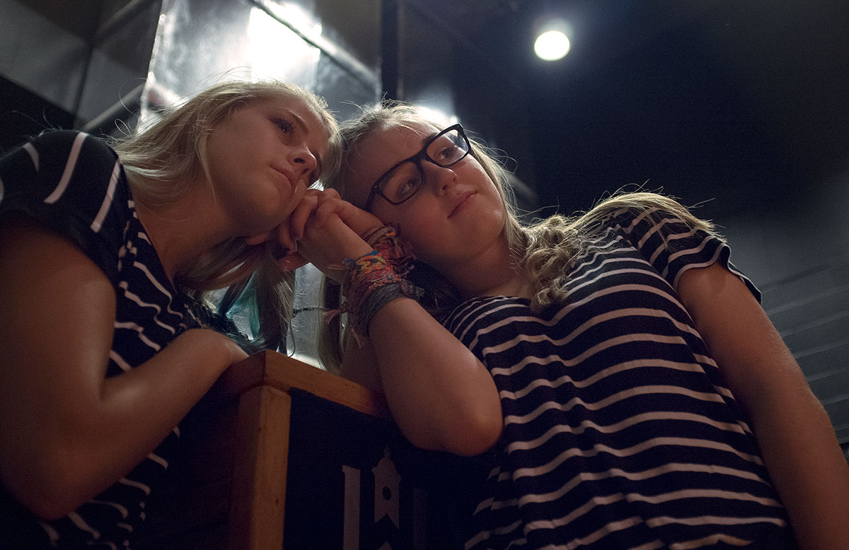 Talent show emcees Olivia Bickett (left) of Owensboro and Madison Fleischaker of Louisville watch an act from backstage Thursday, July 14. (Photo by Tucker Allen Covey)
