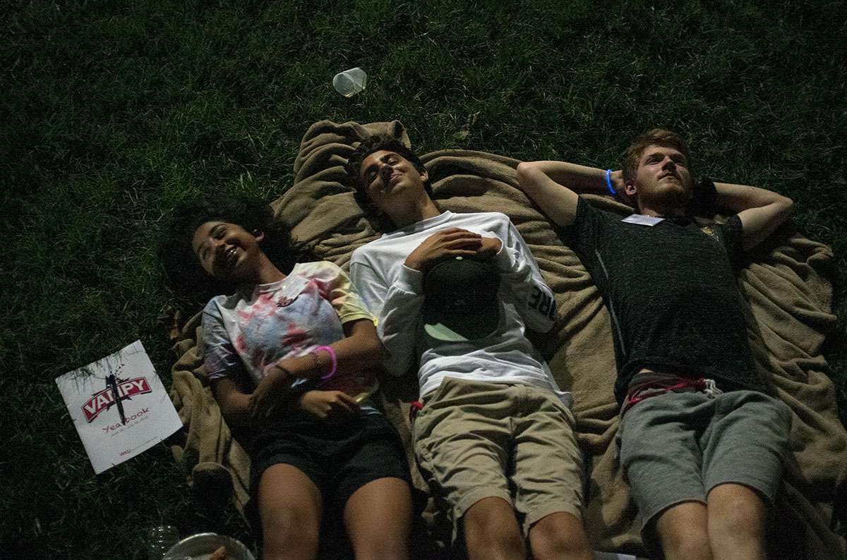 Campers lie on a blanket behind Northeast Hall during their extended community time on the final night of VAMPY Friday, July 15. (Photo by Tucker Allen Covey)