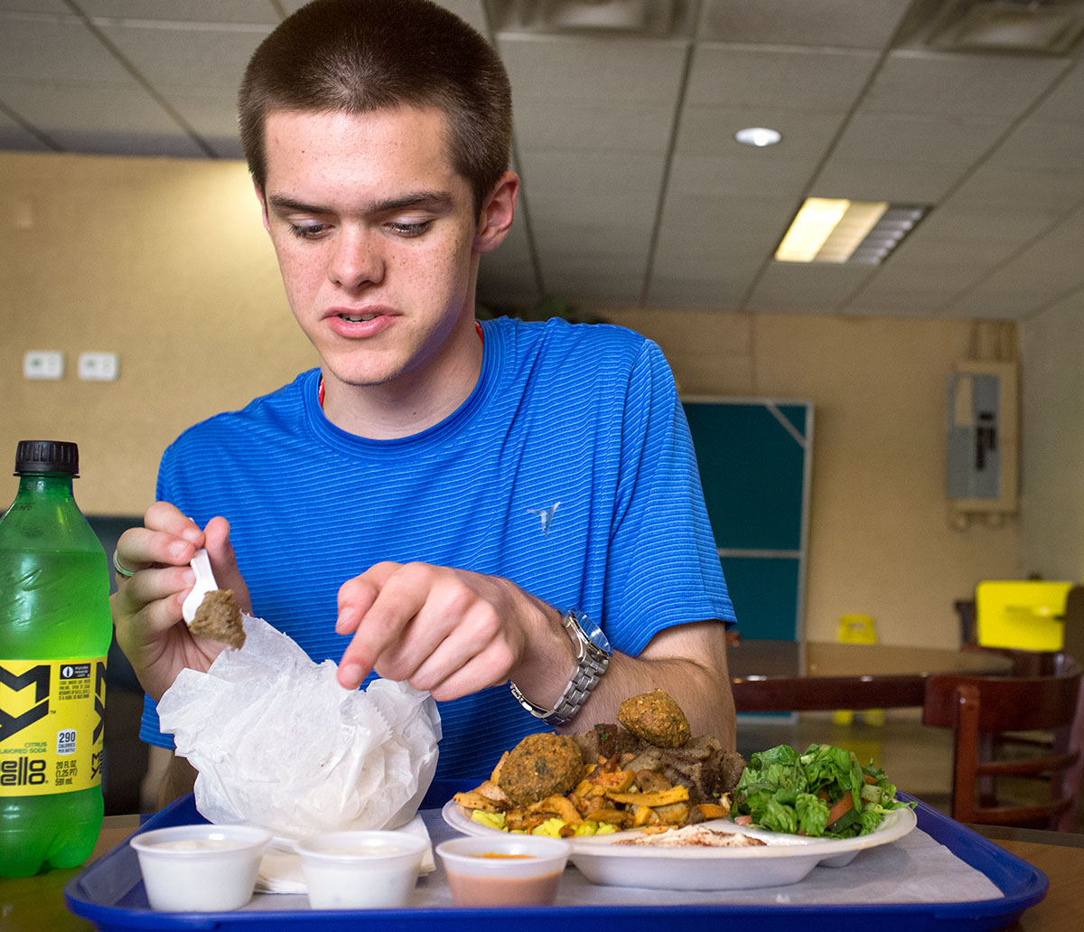 Jake Bowen from Ekron examines the amount of Mediterranean and Middle Eastern food he received during a visit to an international restaurant in Nashville on an Arabic field trip Wednesday, July 13. (Photo by Tucker Allen Covey)