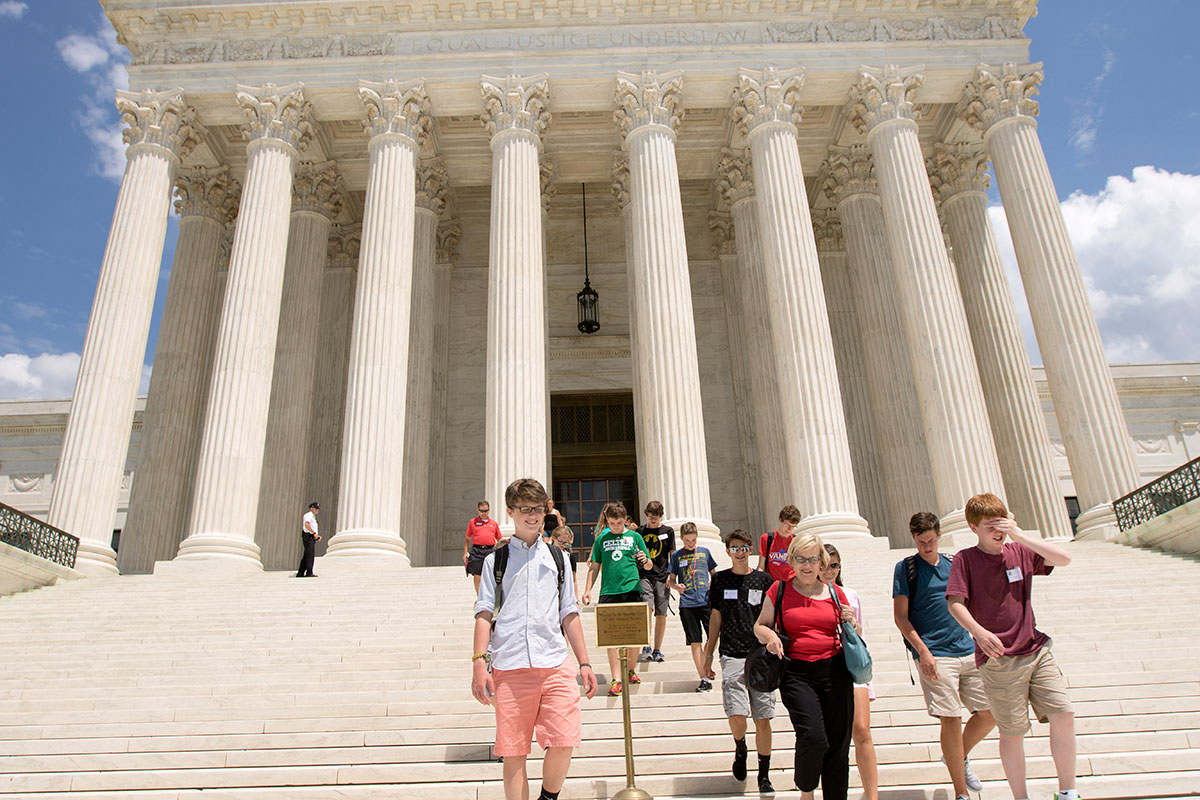 Julia Roberts, the executive director of The Center for Gifted Studies, walks out of the Supreme Court with Presidential Politics students after hearing a lecture in the courtroom during a field trip to Washington D.C. Wednesday, July 6. (Photo by Sam Oldenburg)